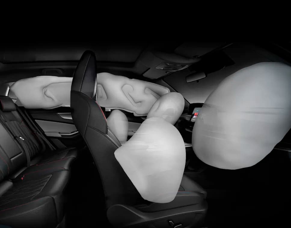 Interior of a car showing the passenger side dashboard with an airbag icon.